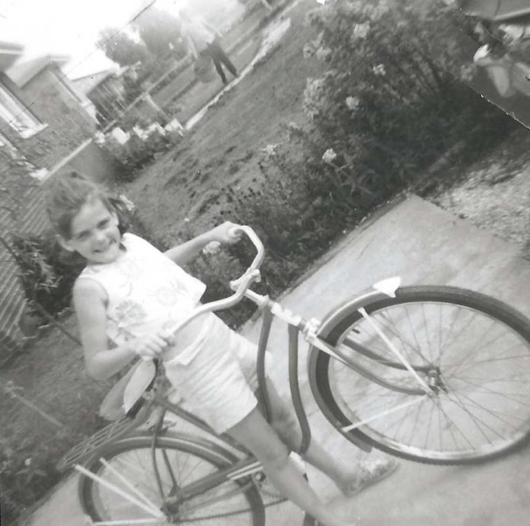 Ann Karkowski on her bike as a child.